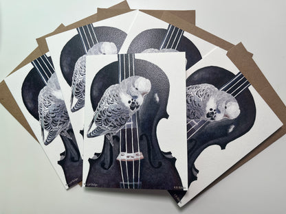 Notecard set featuring the blue‑green budgie perched on a violin watercolor artwork.