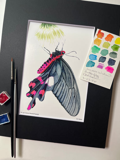 Giclee print of a common windmill butterfly with black wings and crimson markings watercolor displayed in a black mat.