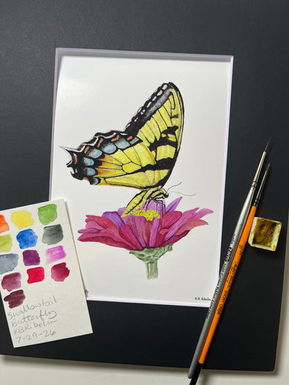 Giclee print of a eastern tiger swallowtail butterfly with yellow and black patterned wings displayed in a black mat.