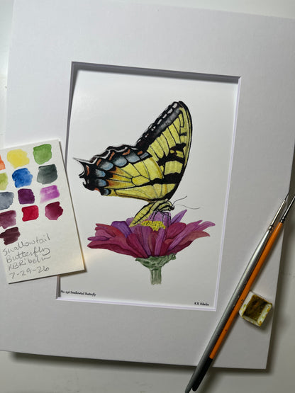 Giclee print of a eastern tiger swallowtail butterfly with yellow and black patterned wings displayed in a white mat.