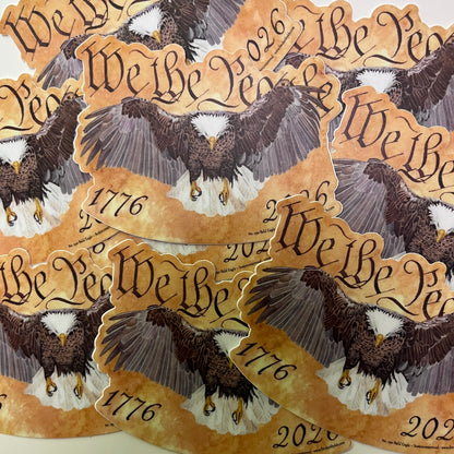 bald eagle flying forward over parchment background with “we the people” lettering