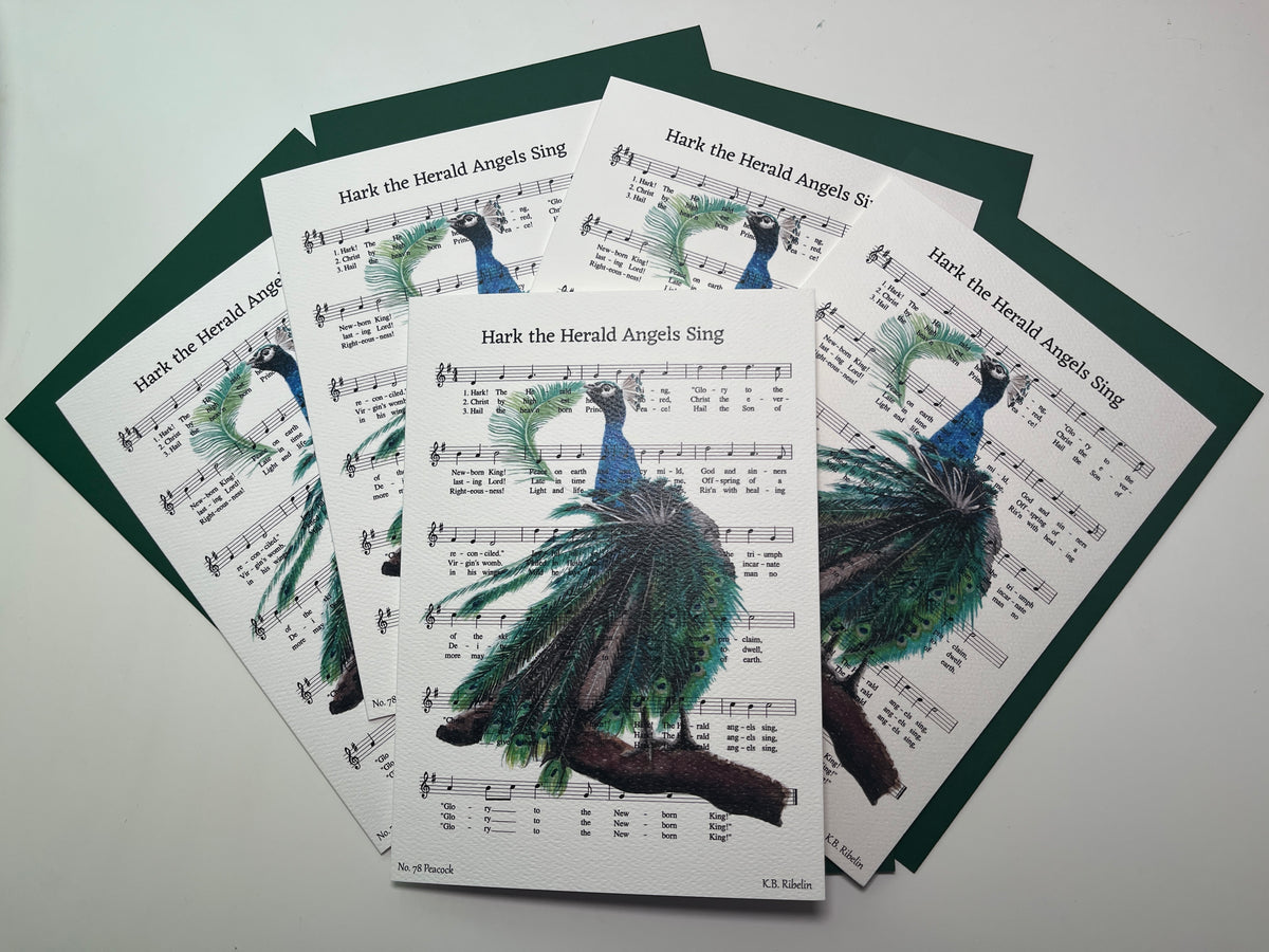 Christmas 2026 notecard set featuring Hark the Herald Angels Sing with festive peacock artwork by KB.