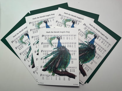 Christmas 2026 notecard set featuring Hark the Herald Angels Sing with festive peacock artwork by KB.
