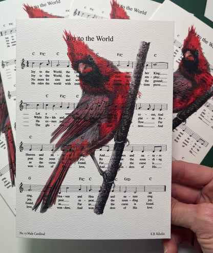 Christmas 2026 notecard featuring Joy to the World with male cardinal artwork by KB.