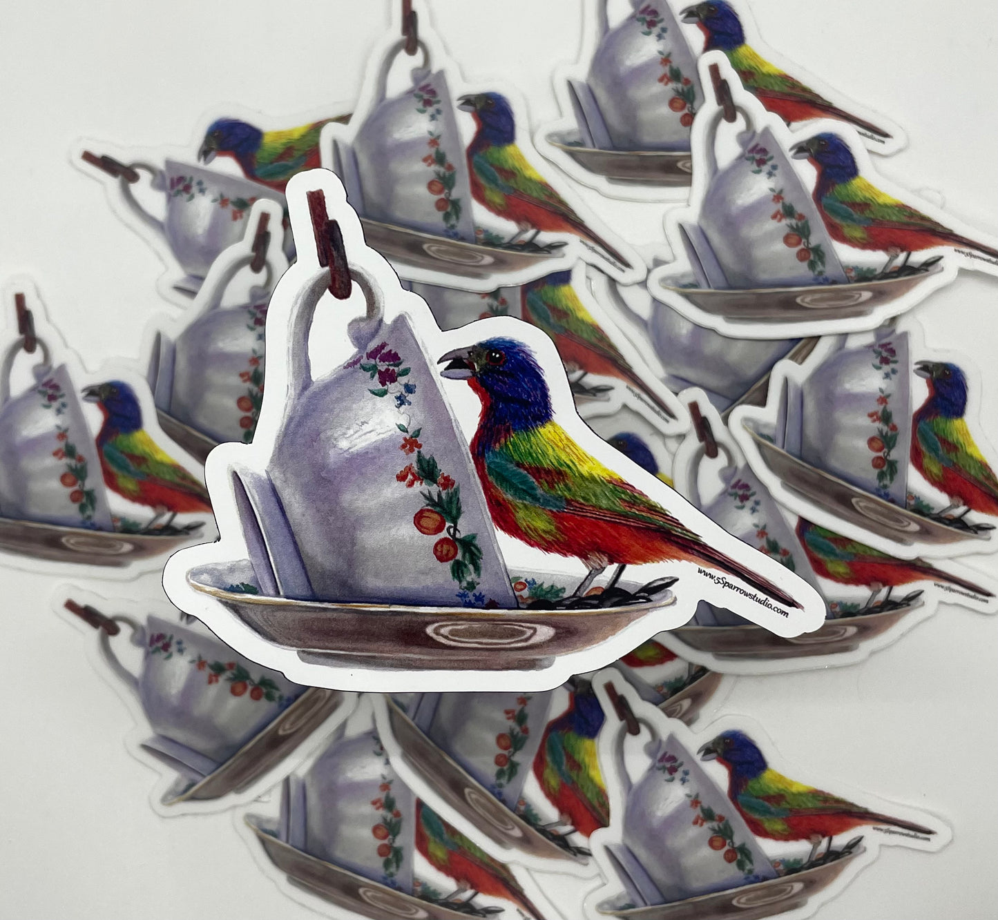 Magnet featuring the painted bunting on a floral teacup painting.